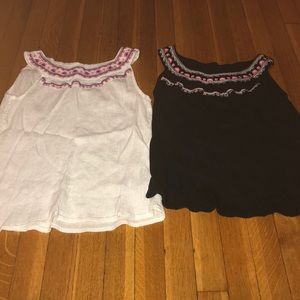 A white and black top with a flower design